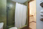 Full bathroom upstairs with a shower tub combo 